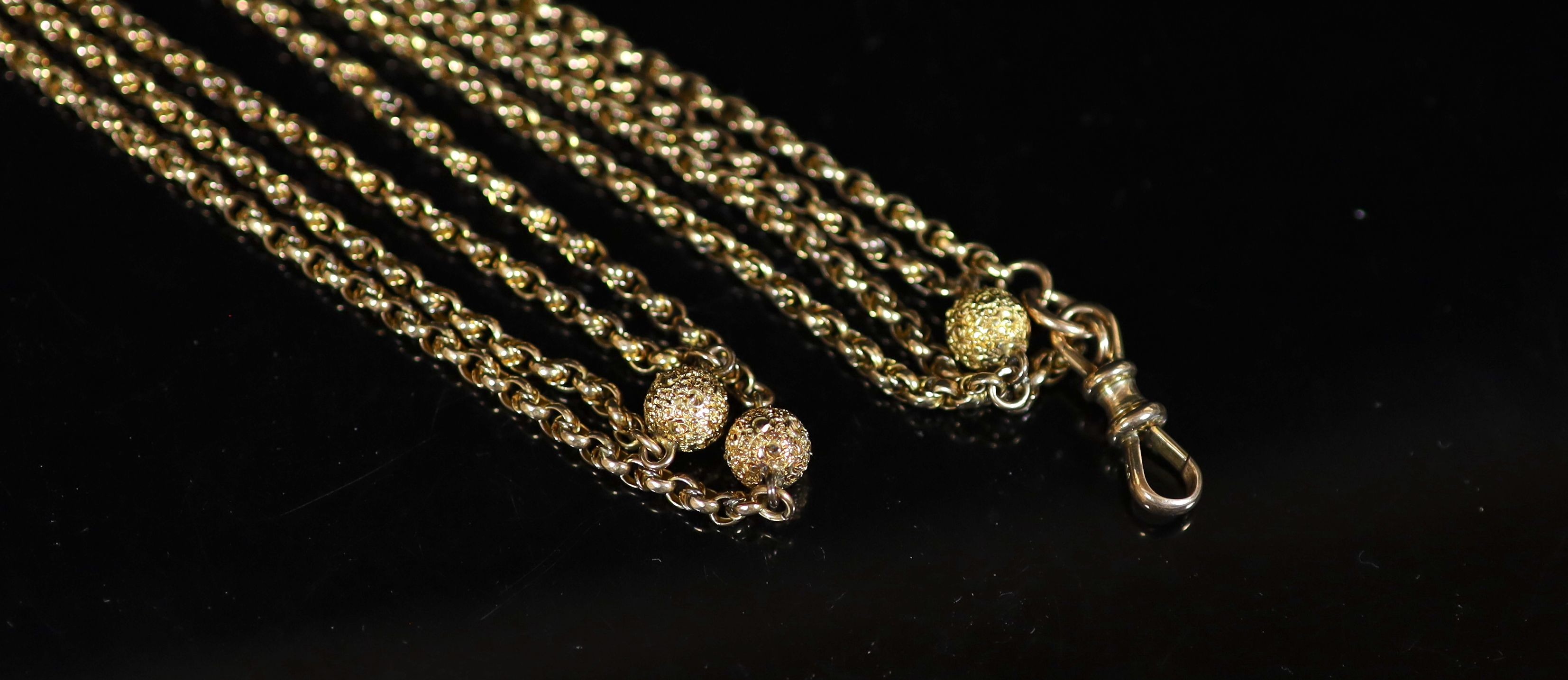 A 19th century 9ct gold guard chain with seven engraved spheres, 124cm